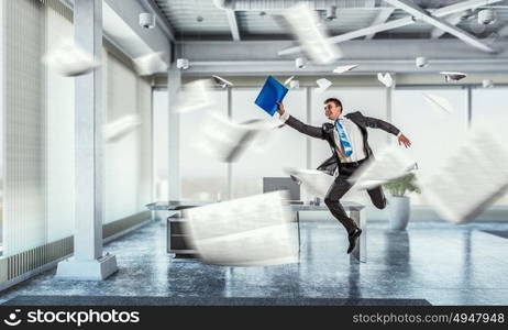 Jumping businessman in office. Funny jumping businessman in modern 3D rendering interior. Mixed media