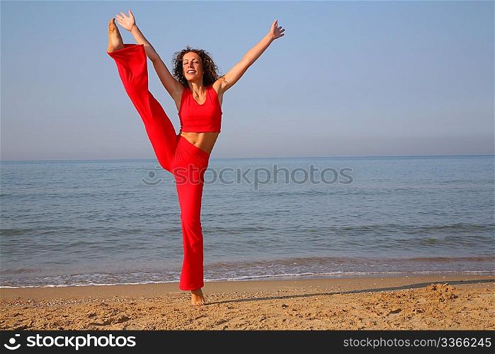 jumping fitness woman on beach