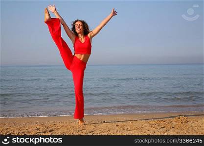 jumping fitness woman on beach