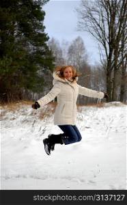 jumping girl wearing winter coat with hood