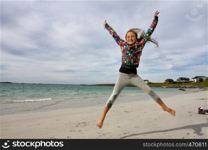 jumping girl with blue sky in the background