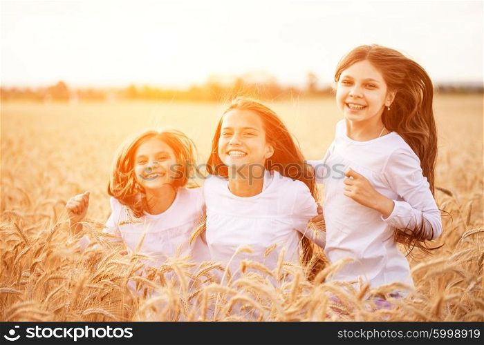 Jumping kids in the wheat field