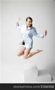Jumping woman wearing shirt