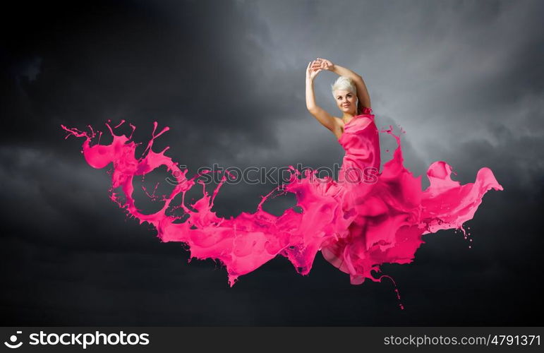 Jumping woman. Young attractive woman in red dress jumping high