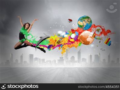 Jumping woman. Young woman dancer in green suit jumping high