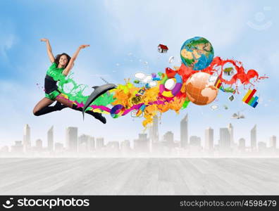 Jumping woman. Young woman dancer in green suit jumping high