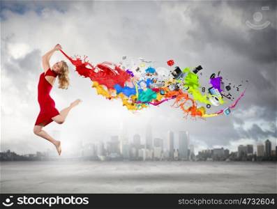 Jumping woman. Young woman dancer in red dress jumping high