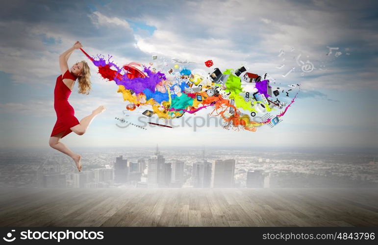 Jumping woman. Young woman dancer in red dress jumping high