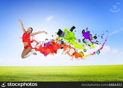 Jumping woman. Young woman dancer in red suit jumping high