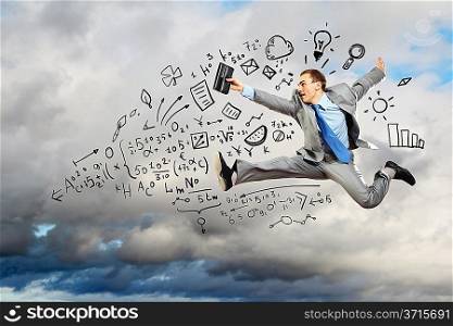 Jumping young businessman