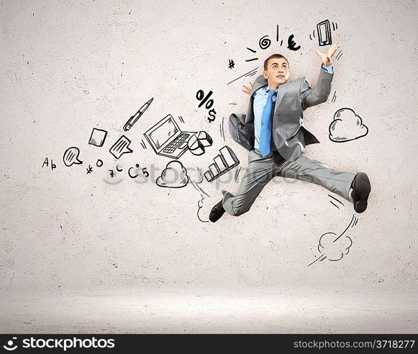 Jumping young businessman