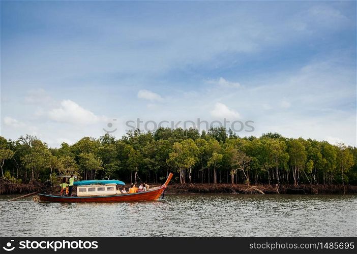 JUN 16, 2012 Koh Lanta, Thailand - Vintage wooden Tourist boat in mangrove forest canal at Koh Lanta
