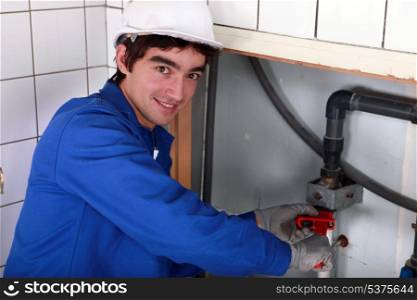 junior plumber at work