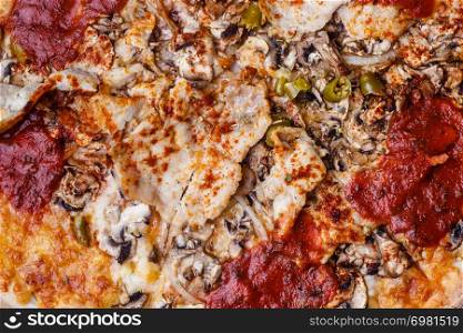 Junk fast food italian cuisine concept. Closeup of hot pizza. Delicious crusty unhealthy spicy meal.. Closeup of hot pizza.