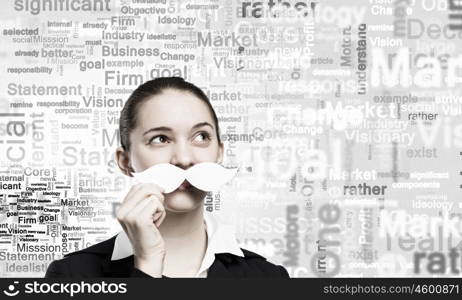 Just like man. Happy cute girl trying male paper mustache