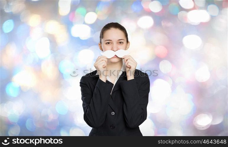 Just like man. Happy cute girl trying male paper mustache