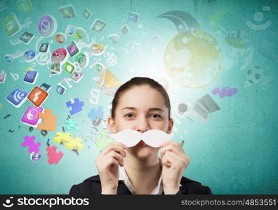 Just like man. Happy cute girl trying male paper mustache