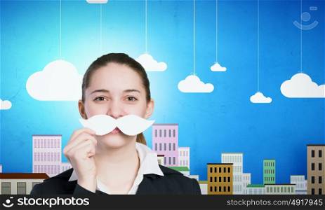 Just like man. Happy cute girl trying male paper mustache