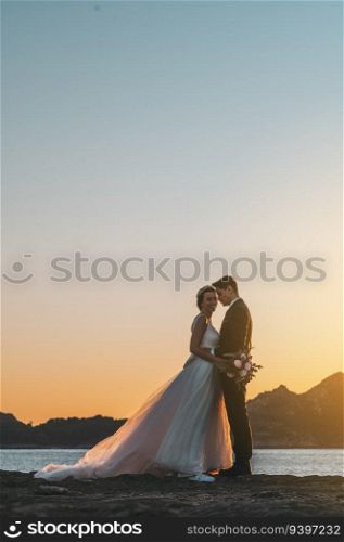 Just married couple against the sky with copy space