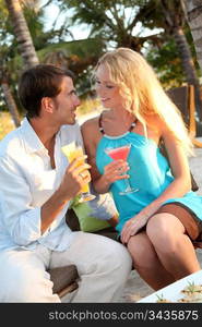 Just married couple having a cocktail in luxury resort