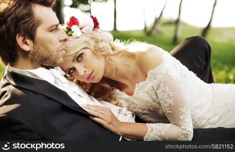 Just married couple resting by the lake