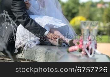 just married couple sitting near fountain