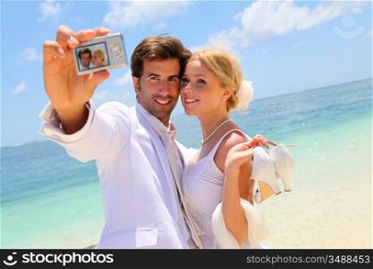 Just married couple taking picture of themselves