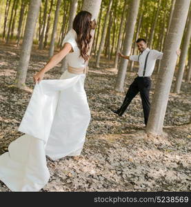 Just married couple together in nature background