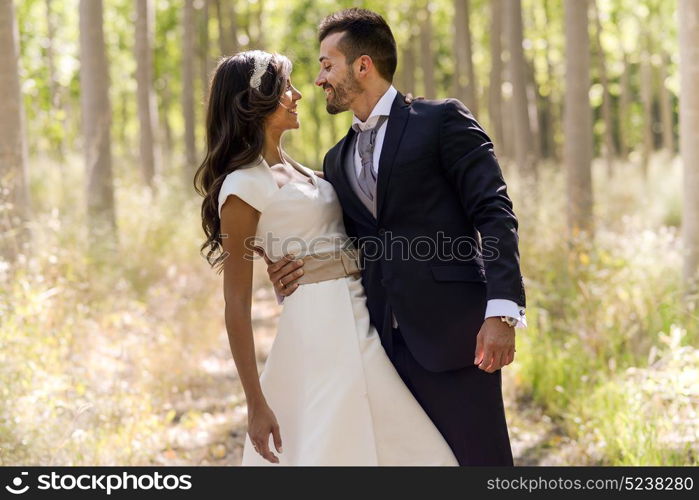 Just married couple together in poplar background