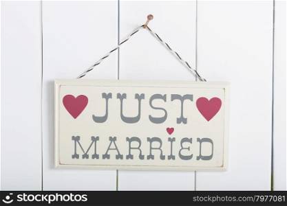 Just married sign with things to go on vacation to the beach