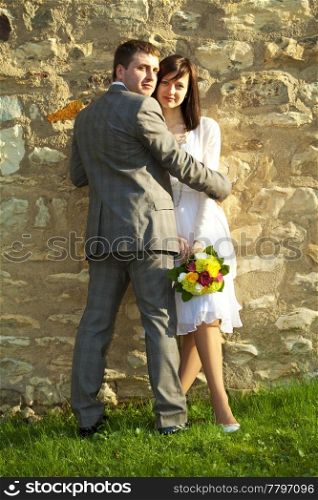 just married standingat wall
