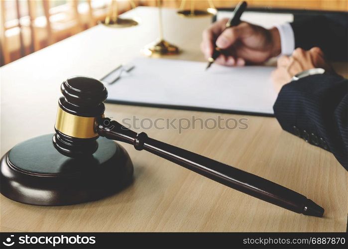 Justice and Law concept. lawyer working on paper documents at courtroom