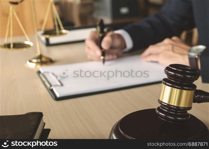 Justice and Law concept. lawyer working on paper documents at courtroom