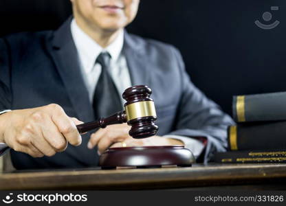 justice and law concept.Male judge in a courtroom working on wood table with documents., attorney court judge justice gavel legal legislation concept