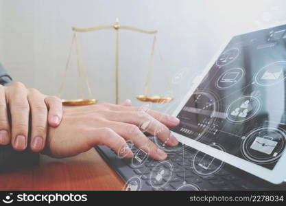 justice and law concept.Male lawyer in office with the gavel,working with smart phone and digital tablet computer and brass scale on wood table,virtual graphic icons screen diagram