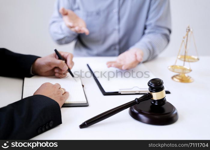 Justice lawyer consulting give a advice with client in courtroom.