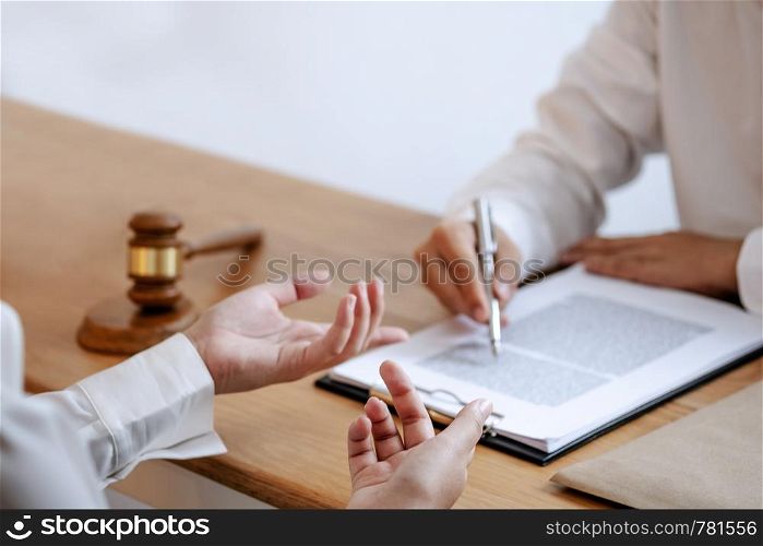 Justice lawyer consulting give a advice with client in courtroom.