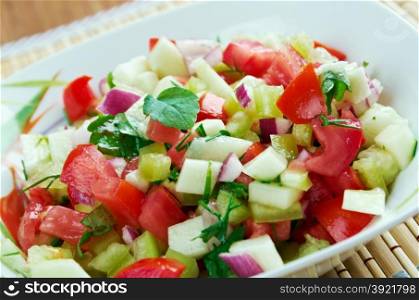 Kachumbari - fresh tomato and onion salad. popular in cuisines of African Great Lakes region.