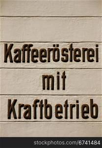 Kaffeeroesterei und Kraftbetrieb. Inscription on a house in Bad Freienwalde: coffee roasting plant and power operating