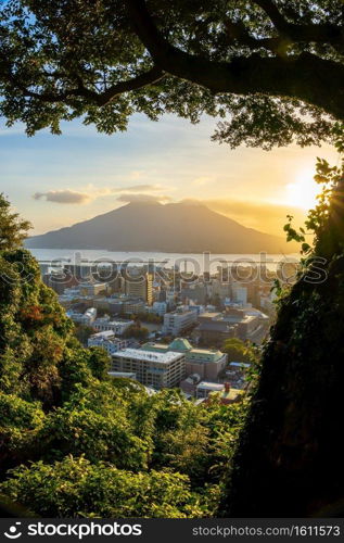 Kagoshima city downtown skyline cityscape  with Sakurajima Volcano in Kyushu, Japan at sunrise