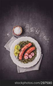Kale with cooked sausage and potatoes