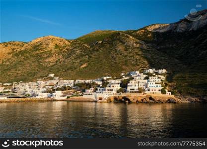 Kamares town on Sifnos island on sunset. Greece. Kamares town with traditional white houses on Sifnos island on sunset. Greece
