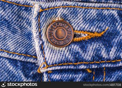 Kamchatka, Russia, November 08, 2016. Close up of the LEVI'S button on the blue jeans. LEVI'S is a brand name of Levi Strauss and Co, founded in 1853