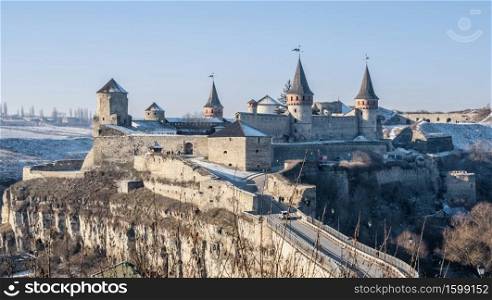 Kamianets-Podilskyi, Ukraine 01.07.2020. Panoramic view of the Kamianets-Podilskyi fortress on a sunny winter morning. Kamianets-Podilskyi fortress on a sunny winter morning