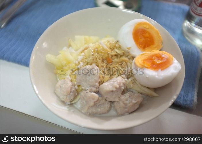 Kanom Cheen Saw Nam or Thai rice noodle with coconut milk with boil egg