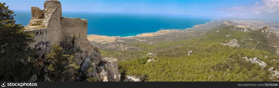 Kantara, Cyprus - June 29, 2018: Wide panorama of the castle of Kantara, the easternmost castle of the three Pentadaktylos mountain range castles in the Ammochostos district in Cyprus. Built at 2068ft it commands both the northern coast and the Mesaoria plain and controls the entrance to the Karpas peninsula. Like the castles of St. Hilarion and Buffavento, it was first built in the Byzantine period after the Arab raids.