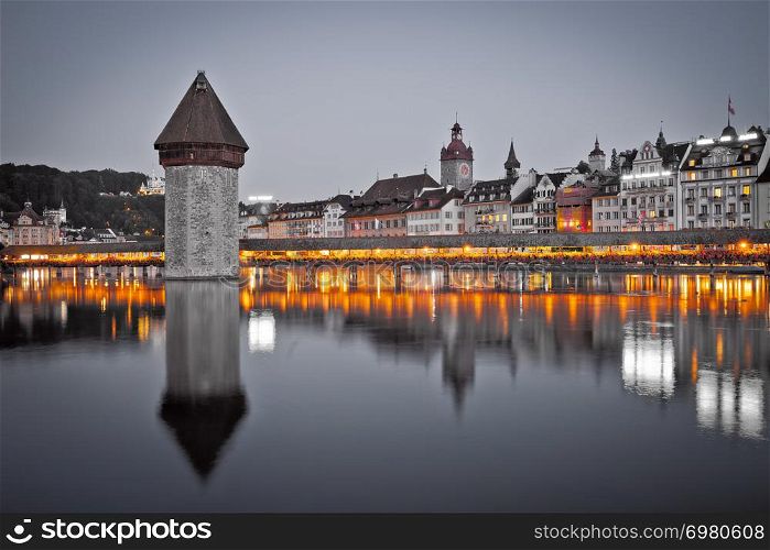 Kapelbrucke in Lucerne famous Swiss landmark black and white with color elements view, famous landmarks of Switzerland