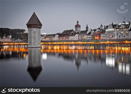 Kapelbrucke in Lucerne famous Swiss landmark black and white with color elements view, famous landmarks of Switzerland