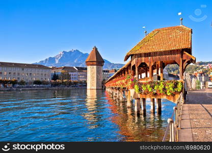 Kapellbrucke historic wooden bridge in Luzern and waterfront landmarks view, town in central Switzerland