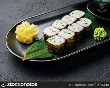 Kappamaki - cucumber sushi roll on black plate